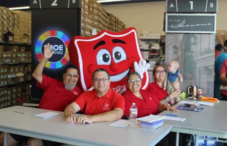 Volunteers with Salvation Army symbol